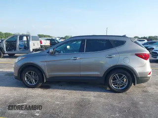 2017 Hyundai Santa Fe 2.4L z VIN 5XYZU3LB0HG420910, wystawiony jako IAAI lot #42017552 z przebiegiem 184 666 mil mil oraz . Historia ofert i sprzedaży dostępna na DreamBid. Obrazek 14.