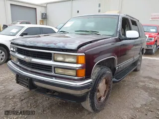 1997 Chevrolet Tahoe with VIN 1GNEK13R8VJ329165, listed as a IAAI auction lot 41631672 with 166,976 mi miles. Bid and sale history available at carsss.com. Image 2.