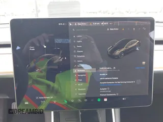 2020 Tesla Model 3 Standard Range Plus z VIN 5YJ3E1EA7LF705809, wystawiony jako IAAI lot #42146416 z przebiegiem 52 056 mil mil oraz . Historia ofert i sprzedaży dostępna na DreamBid. Obrazek 19.