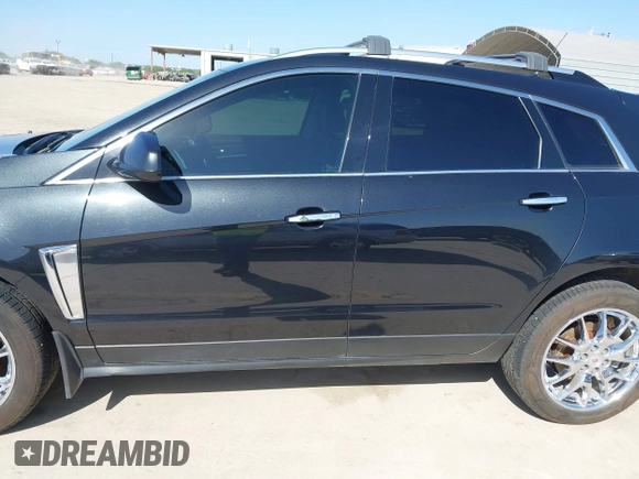 2013 Cadillac SRX Performance Collection with VIN 3GYFNHE35DS548632, listed as a IAAI auction lot 41990670 with 98,659 mi miles. Bid and sale history available at carsss.com. Image 14.