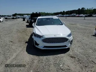 2020 Ford Fusion Titanium с VIN 3FA6P0K99LR174094, выставлен на аукционе Copart как лот 52583435 с пробегом 98 389 миль миль и Списание • Salvage title. История ставок и продаж доступна на DreamBid. Изображение 11.