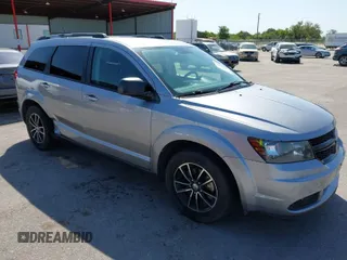 2017 Dodge Journey SE z VIN 3C4PDCAB1HT573511, wystawiony jako IAAI lot #41984865 z przebiegiem 128 721 mil mil oraz . Historia ofert i sprzedaży dostępna na DreamBid. Obrazek 1.