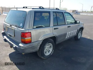 1994 Jeep Grand Cherokee Laredo with VIN 1J4GZ58S4RC325909, listed as a IAAI auction lot 39580601 with 162,952 mi miles. Bid and sale history available at carsss.com. Image 4.