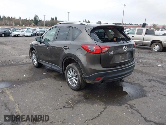 2016 Mazda CX-5 Touring with VIN JM3KE4CY5G0695242, listed as a IAAI auction lot 41795135 with 195,162 mi miles. Bid and sale history available at carsss.com. Image 3.
