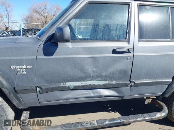 1997 Jeep Cherokee Sport with VIN 1J4FJ68S4VL567490, listed as a IAAI auction lot 41659872 with 404,766 mi miles. Bid and sale history available at carsss.com. Image 6.