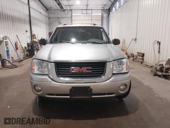2004 GMC Envoy SLE with VIN 1GKDT13S042243883, listed as a IAAI auction lot 41795335 with 162,873 mi miles. Bid and sale history available at carsss.com. Image 12.