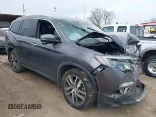 2017 Honda Pilot Touring with VIN 5FNYF6H99HB083593, listed as a IAAI auction lot 42016456 with 138,895 mi miles. Bid and sale history available at carsss.com. Image 1.