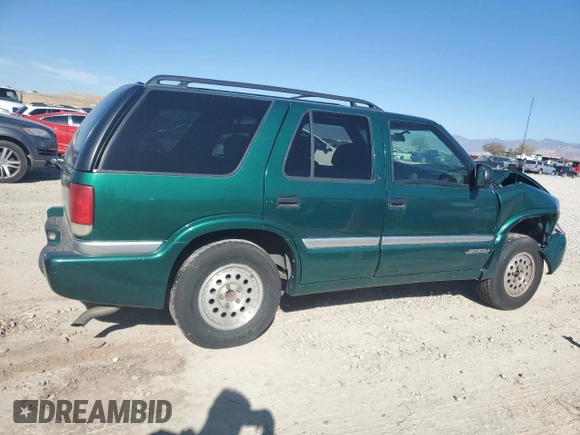 2000 GMC Jimmy SLE Convenience z VIN 1GKDT13W3Y2215035, wystawiony jako Copart lot #77484104 z przebiegiem 116 124 mil mil oraz Szkoda całkowita • Salvage title. Historia ofert i sprzedaży dostępna na DreamBid. Obrazek 3.