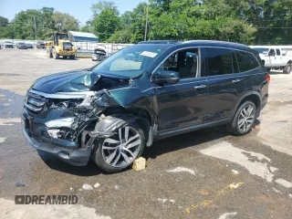 2017 Honda Pilot Touring z VIN 5FNYF6H93HB051982, wystawiony jako Copart lot #53390535 z przebiegiem Nie podano mil oraz Szkoda całkowita • Salvage title. Historia ofert i sprzedaży dostępna na DreamBid. Obrazek 1.