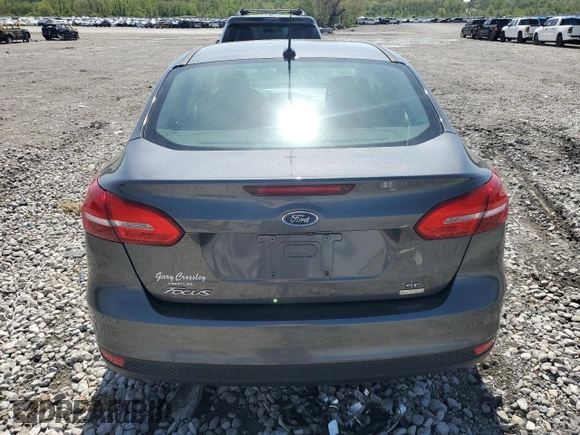 2018 Ford Focus SE с VIN 1FADP3FE5JL312063, выставлен на аукционе Copart как лот 53882065 с пробегом 82 743 миль миль и Списание • Salvage title. История ставок и продаж доступна на DreamBid. Изображение 6.