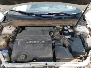 2016 Lincoln MKZ z VIN 3LN6L2GK0GR615898, wystawiony jako Copart lot #62814285 z przebiegiem 231 270 mil mil oraz Szkoda całkowita • Salvage title. Historia ofert i sprzedaży dostępna na DreamBid. Obrazek 11.