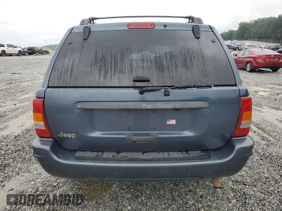 2004 Jeep Grand Cherokee Laredo with VIN 1J4GX48SX4C201569, listed as a Copart auction lot 58631585 with 271,124 mi miles and Salvage title. Bid and sale history available at DreamBid. Image 6.