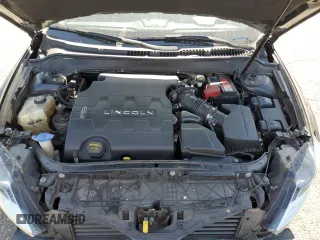 2014 Lincoln MKZ z VIN 3LN6L2GK0ER800286, wystawiony jako Copart lot #57644645 z przebiegiem 130 880 mil mil oraz Szkoda całkowita • Salvage title. Historia ofert i sprzedaży dostępna na DreamBid. Obrazek 11.