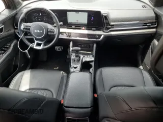 2023 Kia Sportage X-Pro z VIN 5XYK7CAF6PG137375, wystawiony jako Copart lot #57382485 z przebiegiem 27 244 mil mil oraz Szkoda całkowita • Salvage title. Historia ofert i sprzedaży dostępna na DreamBid. Obrazek 8.