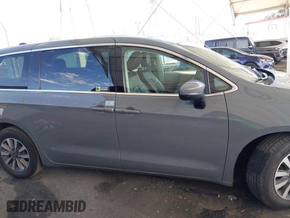 2023 Chrysler Pacifica Hybrid Touring L with VIN 2C4RC1L73PR509853, listed as a IAAI auction lot 41690872 with 83,014 mi miles and . Bid and sale history available at DreamBid. Image 14.