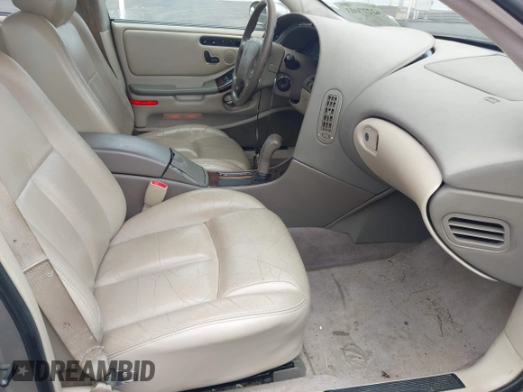 1997 Oldsmobile Aurora z VIN 1G3GR62CXV4121200, wystawiony jako IAAI lot #42277003 z przebiegiem 198 048 mil mil oraz . Historia ofert i sprzedaży dostępna na DreamBid. Obrazek 5.