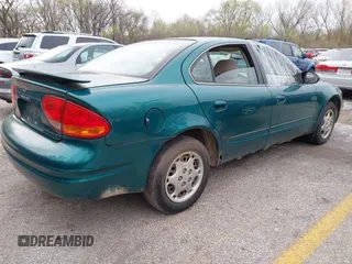 1999 Oldsmobile Alero GL z VIN 1G3NL52T7XC398799, wystawiony jako IAAI lot #41911602 z przebiegiem 252 504 mil mil oraz . Historia ofert i sprzedaży dostępna na DreamBid. Obrazek 4.