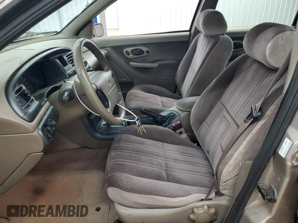 1995 Ford Contour LX with VIN 1FALP6531SK243263, listed as a Copart auction lot 50590725 with 105,347 mi miles and Salvage title. Bid and sale history available at DreamBid. Image 7.