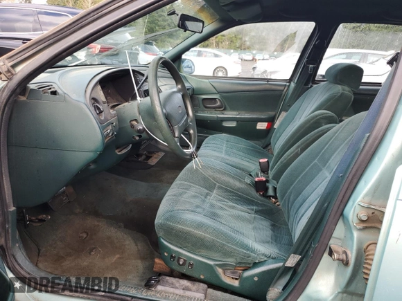 1994 Ford Taurus with VIN 1FALP5747RG236623, listed as a Copart auction lot 85242504 with 205,550 mi miles and Salvage title. Bid and sale history available at DreamBid. Image 7.