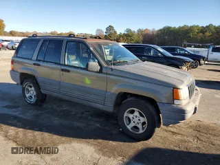 1997 Jeep Grand Cherokee TSi with VIN 1J4FX58S4VC516340, listed as a Copart auction lot 84409044 with 256,300 mi miles and Clean Title. Bid and sale history available at carsss.com. Image 4.