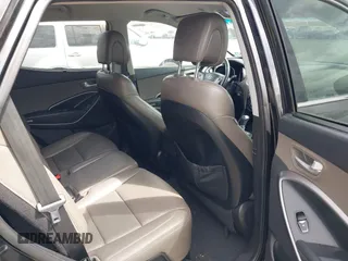 2014 Hyundai Santa Fe z VIN 5XYZUDLBXEG162476, wystawiony jako IAAI lot #41910671 z przebiegiem 146 607 mil mil oraz . Historia ofert i sprzedaży dostępna na DreamBid. Obrazek 8.
