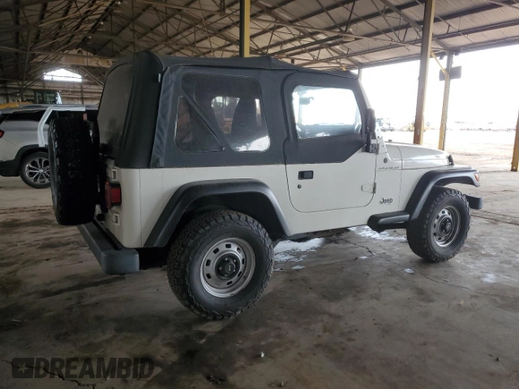 2002 Jeep Wrangler SE with VIN 1J4FA29P12P700276, listed as a Copart auction lot 45109175 with 115,139 mi miles and Salvage Title. Bid and sale history available at DreamBid. Image 3.