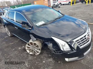 2014 Cadillac XTS Luxury z VIN 2G61N5S33E9198079, wystawiony jako IAAI lot #41171801 z przebiegiem 72 769 mil mil oraz . Historia ofert i sprzedaży dostępna na DreamBid. Obrazek 1.