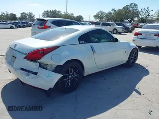 2004 Nissan 350Z Touring with VIN JN1AZ34E74T064156, listed as a IAAI auction lot 41498213 with 148,370 mi miles. Bid and sale history available at carsss.com. Image 4.