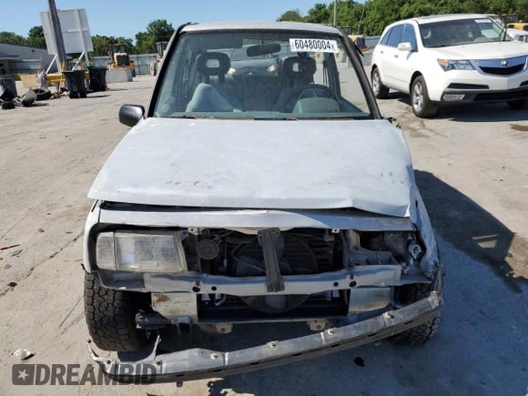 1991 Geo Tracker z VIN 2CNBJ18U3M6909006, wystawiony jako Copart lot #73638944 z przebiegiem 65 033 mil mil oraz Tytuł czysty. Historia ofert i sprzedaży dostępna na DreamBid. Obrazek 5.