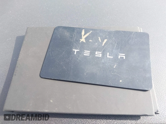 2021 Tesla Model Y Long Range with VIN 5YJYGDEE0MF069451, listed as a IAAI auction lot 41482649 with 55,542 mi miles. Bid and sale history available at carsss.com. Image 11.