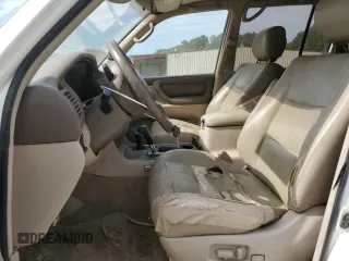 1999 Toyota Land Cruiser z VIN JT3HT05J5X0050404, wystawiony jako Copart lot #56066125 z przebiegiem 385 659 mil mil oraz Tytuł czysty. Historia ofert i sprzedaży dostępna na DreamBid. Obrazek 7.