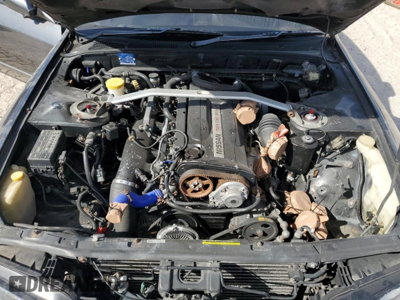 1990 Nissan Skyline z VIN BNR32010431, wystawiony jako Copart lot #78496994 z przebiegiem 182 401 mil mil oraz Nie do naprawy • Non repairable. Historia ofert i sprzedaży dostępna na DreamBid. Obrazek 11.