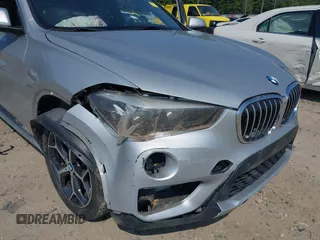 2018 BMW X1 xDrive28i with VIN WBXHT3C39J5L27926, listed as a IAAI auction lot 42582330 with 101,197 mi miles and . Bid and sale history available at DreamBid. Image 6.