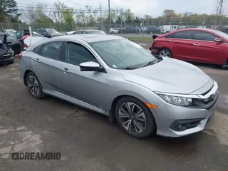2016 Honda Civic EX-T with VIN 19XFC1F32GE008434, listed as a IAAI auction lot 42008935 with 127,454 mi miles and . Bid and sale history available at DreamBid. Image 1.