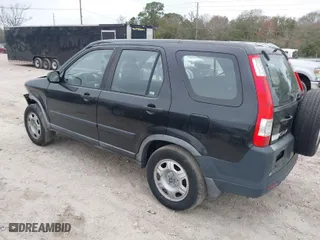 2005 Honda CR-V LX with VIN JHLRD68565C016677, listed as a IAAI auction lot 41570773 with 192,932 mi miles. Bid and sale history available at carsss.com. Image 3.