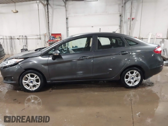 2015 Ford Fiesta SE with VIN 3FADP4BJ9FM164093, listed as a IAAI auction lot 41308905 with 75,839 mi miles. Bid and sale history available at carsss.com. Image 14.