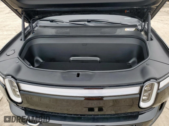 2024 Rivian R1S Adventure z VIN 7PDSGABAXRN035556, wystawiony jako Copart lot #59114065 z przebiegiem 9119 mil mil oraz Szkody całkowita. Historia ofert i sprzedaży dostępna na DreamBid. Obrazek 12.