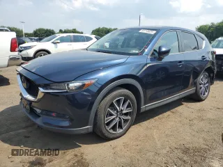 2018 Mazda CX-5 Touring z VIN JM3KFBCM6J1441149, wystawiony jako Copart lot #59718625 z przebiegiem 116 757 mil mil oraz Czysty tytuł • Clean title. Historia ofert i sprzedaży dostępna na DreamBid. Obrazek 1.