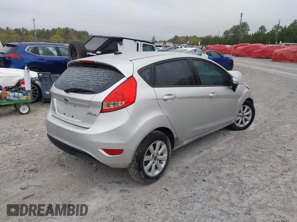 2013 Ford Fiesta SE with VIN 3FADP4EJ6DM107293, listed as a IAAI auction lot 41898229 with 129,694 mi miles. Bid and sale history available at carsss.com. Image 4.