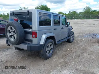 2018 Jeep Wrangler Unlimited Sahara with VIN 1C4BJWEGXJL806832, listed as a IAAI auction lot 42605892 with 90,535 mi miles and . Bid and sale history available at DreamBid. Image 4.