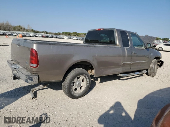 2002 Ford F-150 XL with VIN 1FTRX17L22NA48307, listed as a Copart auction lot 74238074 with 80,010 mi miles and Salvage title. Bid and sale history available at DreamBid. Image 3.