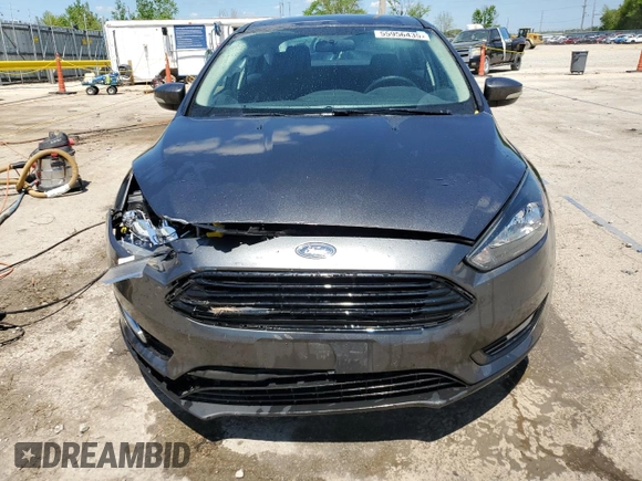 2018 Ford Focus SE z VIN 1FADP3F20JL257320, wystawiony jako Copart lot #55956435 z przebiegiem 26 919 mil mil oraz Szkoda całkowita • Salvage title. Historia ofert i sprzedaży dostępna na DreamBid. Obrazek 5.