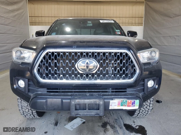 2019 Toyota Tacoma 4WD SR with VIN 5TFCZ5AN5KX185683, listed as a Copart auction lot 54176255 with 106,524 mi miles and Clean Title. Bid and sale history available at carsss.com. Image 5.