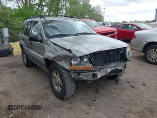 2001 Jeep Grand Cherokee Laredo z VIN 1J4GW48S01C658017, wystawiony jako IAAI lot #42160310 z przebiegiem 220 309 mil mil oraz . Historia ofert i sprzedaży dostępna na DreamBid. Obrazek 1.