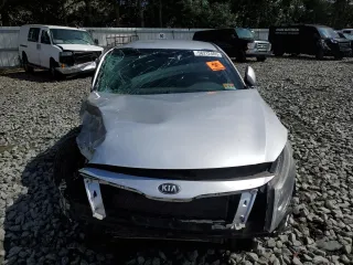 2014 Kia Optima LX z VIN 5XXGM4A79EG311308, wystawiony jako Copart lot #58212405 z przebiegiem 147 006 mil mil oraz Szkoda całkowita • Salvage title. Historia ofert i sprzedaży dostępna na DreamBid. Obrazek 5.