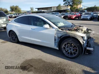 2020 Tesla Model 3 Standard Range Plus with VIN 5YJ3E1EA0LF808571, listed as a Copart auction lot 47827615 with 125,444 mi miles and Salvage Title. Bid and sale history available at DreamBid. Image 4.