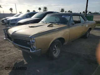 1967 Pontiac GTO z VIN 242177P108834, wystawiony jako Copart lot #74698414 z przebiegiem 230 374 mil mil oraz Szkoda całkowita • Salvage title. Historia ofert i sprzedaży dostępna na DreamBid. Obrazek 1.