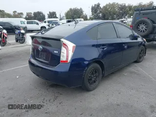 2014 Toyota Prius Four with VIN JTDKN3DU7E1779813, listed as a IAAI auction lot 42395989 with 148,626 mi miles and . Bid and sale history available at DreamBid. Image 4.