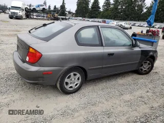 2004 Hyundai Accent GL with VIN KMHCG35C44U299645, listed as a Copart auction lot 63728174 with 159,604 mi miles and Clean Title. Bid and sale history available at carsss.com. Image 3.