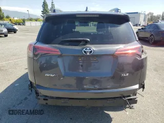 2018 Toyota RAV4 XLE with VIN 2T3WFREVXJW439401, listed as a Copart auction lot 52359275 with 148,274 mi miles and Salvage Title. Bid and sale history available at carsss.com. Image 6.